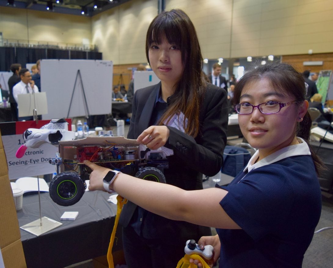 Chinese students displaying their prototype