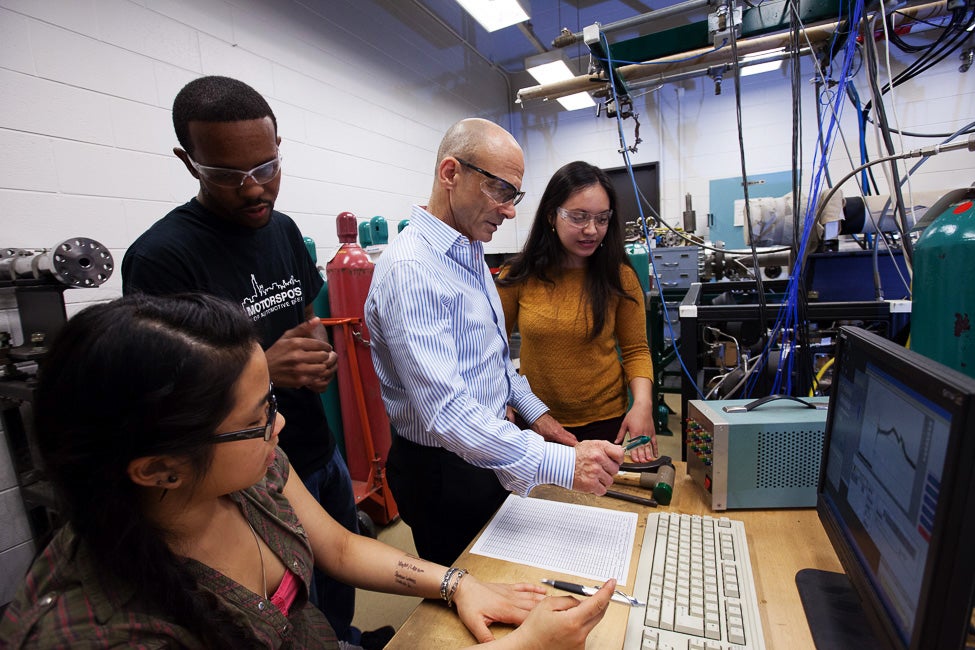 students and faculty in a research lab