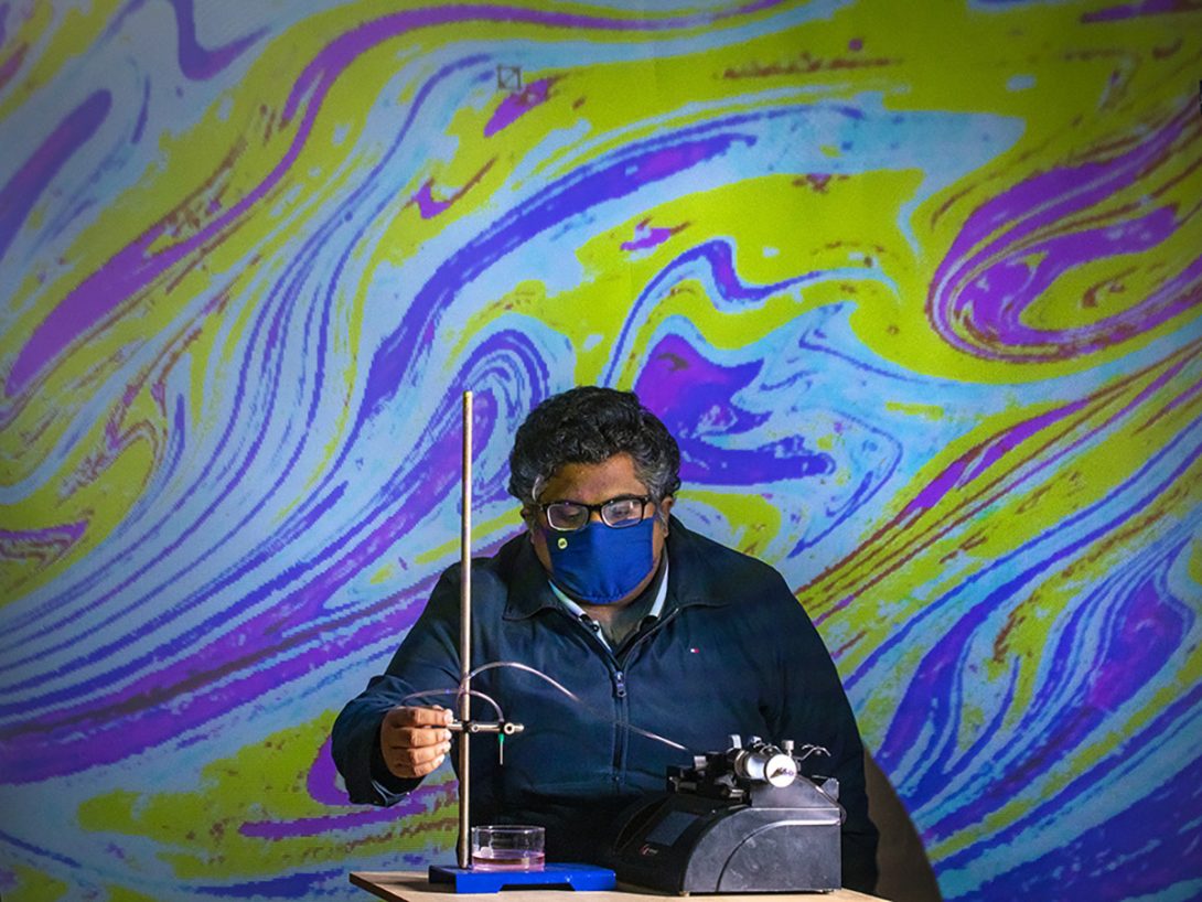Varun Kulkarni, a post-doc researcher at UIC, investigating oil droplets in water
