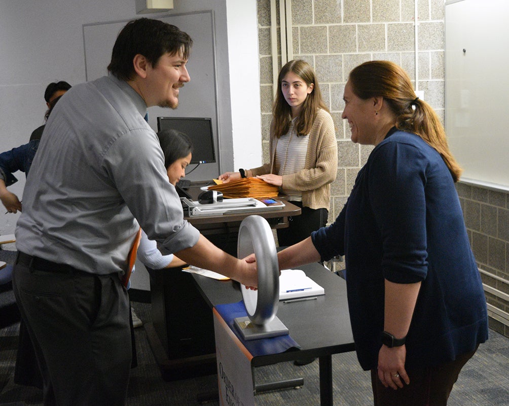 60 young men and women from the College of Engineering participated in the Order of the Engineer ring ceremony on May 4 at the University of Illinois Chicago.