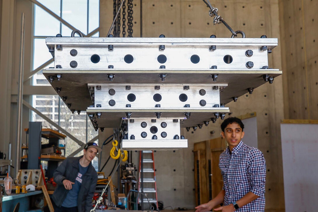 Caleb Smith (right) looks over a celestial landing device with his team member Sam “Fish” Hooson.