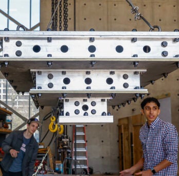 Caleb Smith (right) looks over a landing device with his team member Sam “Fish” Hooson. 